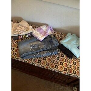 ￼5 girls shirts and 1 jean flare with floral accents. Some brands are Addis, so,